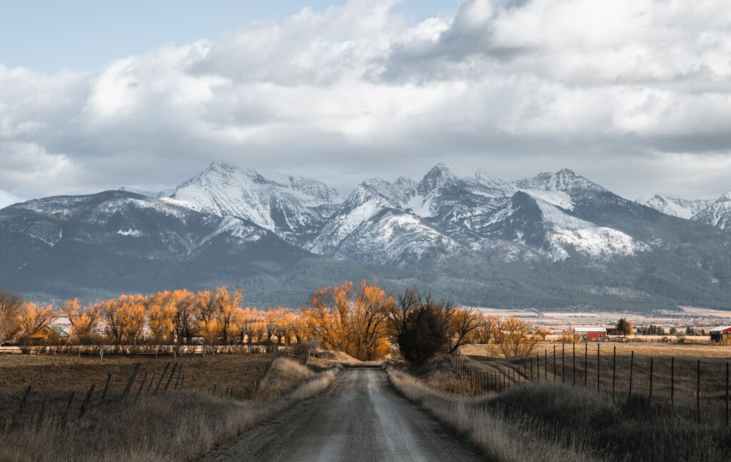 Discover the breathtaking autumn landscape with snow-capped mountains in Montana, USA.
